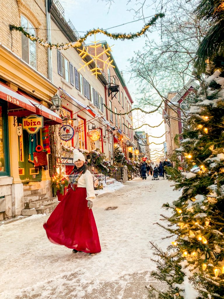 Twinklight lights overhead and charming storefronts in Quartier Petit Champlain