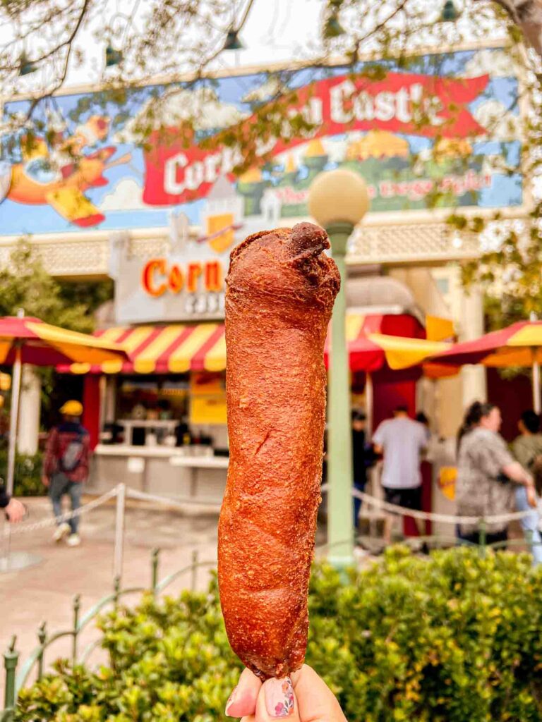 Corn dog in front of Corn Dog Castle